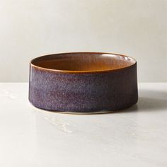 a brown bowl sitting on top of a white counter