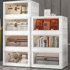 a white bookcase filled with lots of books and stuffed animals next to each other