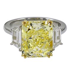 Magnificent engagement ring from ISSAC NUSSBAUM NEW YORK. This beautiful elongated Radiant cut fancy yellow diamond is flanked by two colorless stones. The Magic is in the cut! This stone is special and rare given that its Elongated radiant cut. the stone also appears far larger and higher color saturation than its certificate would suggest. Elongated Radiant Cut, Elongated Radiant, Asscher Cut Diamond Ring, Radiant Cut Diamond Engagement Rings, Asscher Cut Engagement Rings, Diamond Rings With Price, Emerald Cut Diamond Engagement, Emerald Cut Diamond Ring, Asscher Cut Diamond