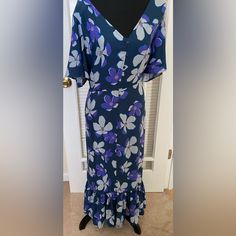 Flutter Sleeve Flower Print Maxi Dress. Size:18 Nwt Purple Floral Print Midi Dress For Garden Party, Purple Ruffled Midi Dress For Garden Party, Flowy Purple Midi Dress For Garden Party, Purple V-neck Dress With Ruffle Hem, Purple Ruffle Hem Dress For Vacation, Purple Ruffled Short Sleeve Maxi Dress, Chic Purple Floral Print Maxi Dress, Purple V-neck Midi Dress For Garden Party, Purple Dress With Ruffle Hem For Vacation