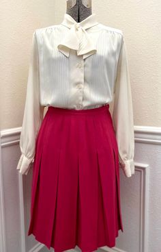 Vintage 1960s Century of Boston Pink Wool Pleated Skirt! Description:   - Vintage Pink Wool Pleated Skirt   - Button and Metal Zipper Side Closure Condition:   - Fantastic Vintage Condition!   - No visible flaws, tears, or stains Measurements (Laid Flat):  Waist: 13" Hips: 18" Center Back to Hem: 22 1/2" **Please note that all sales are final, regardless of size, fit, color, etc. Be sure to check measurements and read the entire description before purchasing! If you have any questions about an i Vintage White Pleated Skirt, Vintage Formal Skirt, Vintage Pleated Skirt For Spring Workwear, Retro Pleated Work Skirt, Retro Pleated Lined Skirt For Work, Vintage Fitted Pleated Skirt For Work, Vintage Full Skirt For Workwear, Retro Pleated Skirt For Work, Fitted Vintage Pleated Skirt For Work