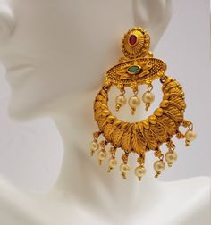 This beautiful earrings set has an excellent finish and gives out an exquisite sense of style. If you are looking for an amazing Fashion Jewelry set for special occasions such as Anniversary, Engagement, Party, Wedding, or for gifting, then your search ends here. Handmade Indian Temple Jewelry, best to wear it for traditional ceremonies or Indian wedding. This bridal jewelry has an ethnic finish. It has Cubic Zircon stones with semi-precious ruby and emeralds. It is a Bollywood style one gram je Wedding Meenakari Pearl Earrings, Gold Pearl Drop Earrings For Reception, Kundan Bridal Earrings In Temple Jewelry Style, Kundan Temple Jewelry Bridal Earrings, Wedding Chandbali Danglers In 22k Gold, 22k Gold Chandbali Wedding Danglers, Kundan Bridal Earrings With Elegant Temple Design, Temple Jewelry Pearl Drop Danglers For Reception, Pearl Drop Temple Jewelry Danglers For Reception