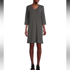 New With Tag Eileen Fisher Tencel Lyocell Stretch V-Neck 3/4 Sleeve Drop Shoulder Pocketed Waistless Dress From Eileen Fisher, This Dress Features: Fluid And Polished Stretch Tencel Lyocell Fabrication Shift Silhouette V-Neckline 3/4 Sleeves Medium-Weight Jersey That Goes From Day To Night Drop Shoulders Angle Side Seam Front Pockets Easy Fit Straight Hemline Pullover Construction Approx. 39" Length Tencel Lyocell/Elastane Machine Wash Imported. Casual V-neck Dress For Fall Workwear, Casual V-neck Dress For Work In Fall, Casual V-neck Dress For Work, Fall Season, Casual Fall V-neck Work Dress, Summer V-neck Dress With 3/4 Sleeves, Eileen Fisher Dress, Eileen Fisher, Medium Weight, Drop Shoulder