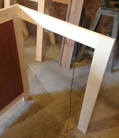 a wooden table being built in a shop