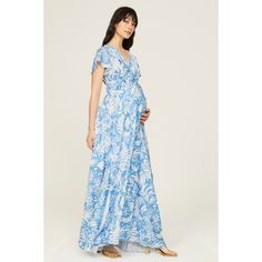 Blue floral crepe (95% Polyester 5% Spandex). Wrap. Short sleeves. V-neck. Tie closure. 57.5" from shoulder to hemline. Imported. Printed V-neck Rayon Maxi Dress, V-neck Rayon Maxi Dress With Floral Print, Floral Print Rayon Maxi Dress With V-neck, Blue Rayon V-neck Maxi Dress, Blue Floral Print Rayon Maxi Dress, Blue V-neck Rayon Maxi Dress, Printed Rayon V-neck Maxi Dress, Printed Rayon Maxi Dress With V-neck, Maternity Maxi