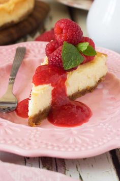 there is a slice of cheesecake with raspberry sauce on the top and bottom