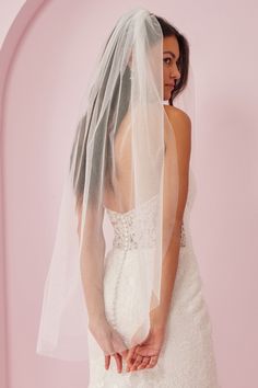 a woman in a wedding dress and veil