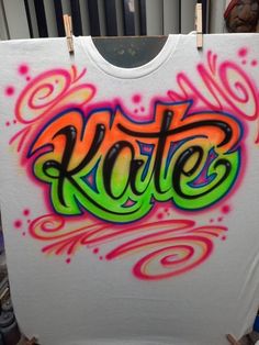 a t - shirt with the word kite painted on it