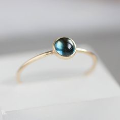 Tiny skinny stackable ring with beautiful London Blue Topaz is a gentle piece for a minimalist style lover. It is made with a skinny but sturdy band, perfect for everyday wear. It is a great addition to a festive outfit too.The ring is 0,8-0,9 mm thick and looks very dainty on the finger. Choose the size of the stone (3 or 5 mm) and material for the ring (sterling silver or 9k gold).If you want to change the ring band design or get a custom ring or ring sets, feel free to contact me.You can orde Fine Jewelry Sapphire Stackable Birthstone Rings, Everyday Stackable Sapphire Ring Fine Jewelry, Everyday Stackable Sapphire Ring In Fine Jewelry Style, Everyday Sapphire Ring Jewelry, Minimalist Blue Topaz Birthstone Ring, Blue Stackable Jewelry For Everyday, Blue Stackable Everyday Jewelry, Dainty Blue Sapphire Stackable Ring, Dainty Sapphire Ring In Sterling Silver With Yellow Gold