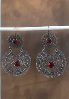 DESCRIPTION: Oaxaca's statement drop filigree earrings with red stone.  Oxidized 925 Sterling silver. The earrings are Hallmarked. Approximately 2.6 inch long and 1.55 inch wide. Red Dangle Filigree Jewelry, Red Filigree Drop Earrings, Mexican Filigree Earrings, Red Sterling Silver Filigree Earrings, Red Bohemian Filigree Jewelry, Filigree Earrings, Sterling Silver Filigree, Red Stone, Silver Filigree