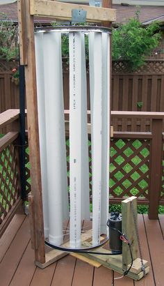 an outdoor water heater on a deck with the words diy vertical axiss wind turbine