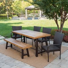 a wooden table sitting on top of a patio