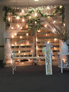 a room decorated with lights and greenery