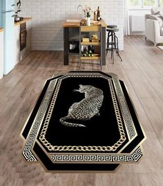 a black and gold area rug with an image of a cat sitting on the floor