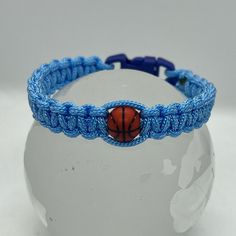 Paracord Bracelet With Buckle Closure And Affixed Charm. Approx Width: 0.50” Fits Wrist Up To 7.75” Casual Paracord Bracelets For Gift, Blue Nylon Cord Friendship Bracelets As Gift, Blue Nylon Cord Friendship Bracelet As Gift, Blue Nylon Cord Friendship Bracelets With Sliding Knot, Handmade Blue Nylon Cord Braided Bracelets, Handmade Blue Braided Nylon Cord Bracelets, Handmade Blue Nylon Cord Jewelry, Handmade Blue Braided Bracelets In Nylon Cord, Blue Sliding Knot Friendship Bracelets In Nylon Cord