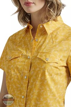 Wrangler 112347162 Yellow Western Snap Short Sleeve Shirt The Wrangler® Women's Western Short Sleeve Snap Shirt provides plenty of cowgirl style while offering a comfortable partly recycled cotton blend. Classic Western details, including snap spade pockets and a snap front closure, add an elevated look that easily transitions from a long day at work to hanging out with friends. Short sleeve Front snap closure Two front spade pockets with snap closure 55% Cotton, 45% Recycled Polyester Style# 11 Cowgirl Style, Recycled Cotton, Hanging Out, Short Sleeve Shirt, Sleeve Shirt, Cotton Blend, Yellow