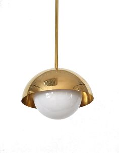 a white and gold light hanging from a ceiling