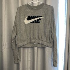 Cute Lightweight Nike Long Sleeve. A Little Lighter Than A Crewneck. Elastic Band Which Is Super Comfy! Never Worn Only Washed. Women’s Size Medium Nike Gray Tops For Fall, Crop Long Sleeve, Tops Nike, Nike Long Sleeve, Nike Tops, Sweater Jacket, Elastic Band, Nike Women, Long Sleeve Tees