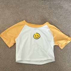 Nwot Great Condition Size Small Smoke Free Home Ships Quickly Bundle To Save!! Yellow Cotton Short Sleeve Crop Top, Yellow Cotton Crop Top With Short Sleeves, Cute Yellow Crew Neck Top, Playful White Top With Smiley Face, Cute Yellow Top With Graphic Print, Cute Yellow Cotton T-shirt, Spring Crew Neck Top With Smiley Face, Cute Yellow Graphic Print Top, Spring Smiley Face Crew Neck Top