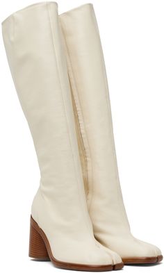 Find MAISON MARGIELA White Tabi Boots on Editorialist. Knee-high grained nappa leather boots in white. · Cleft toe · Zip closure at inner side · Buffed calfskin lining · Stacked leather cylindrical heel with rubber injection · Calfskin sole · Heel: H3 in Supplier color: White