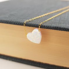 Fall in love with this delicate white heart opal pendant displayed on a 14K gold filled chain. This dainty opal jewelry is a perfect gift for a special person. A fantastic present to give as Valentine's day gift. Delicate Opal Chain Jewelry Gift, Delicate Opal Chain Jewelry As Gift, Delicate Opal Chain Jewelry For Gifts, Opal Jewelry With Delicate Chain As Gift, Dainty White Heart Necklace For Her, White Opal Necklace With Delicate Chain, Delicate Opal Jewelry For Gifts, Delicate Opal Jewelry Gift, Opal Jewelry As Valentine's Day Gift