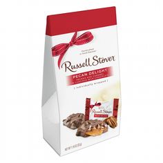 a box of russell stover pecan delight chocolates with a red ribbon on top