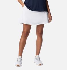 A lightweight, sweat-wicking golf skort. Casual Golf Skort For Summer, Casual Summer Golf Skort, White Golf Skort For Spring, Navy Sporty Skort For Sports, Casual Golf Skort For Spring, Casual Moisture-wicking 4-way Stretch Skort, Casual Spring Golf Skort, Sporty Stretch Skort For Golf, Athleisure Summer Golf Skort