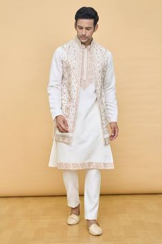 Cream longline Nehru jacket with contrasting floral jaal pattern aari tilla embroidery. Comes with embroidered placket and bordered kurta and a pant. - Aza Fashions Eid Outerwear Straight Kurta With Intricate Embroidery, Bollywood Style Outerwear With Chikankari Embroidery, Festive Bollywood Outerwear With Chikankari Embroidery, Festive Long Sleeve Nehru Jacket With Chikankari Embroidery, Eid Chikankari Embroidery Straight Kurta Outerwear, Bollywood Style Outerwear With Chikankari Embroidery For Wedding, Bollywood Style Outerwear With Resham Embroidery For Eid, Eid Chikankari Embroidery Straight Kurta, Eid Outerwear Straight Kurta With Resham Embroidery