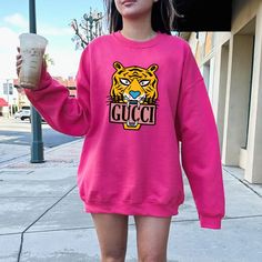 Colors: Heliconia, Sizes: S Casual Pink Sweater With Graphic Print, Casual Pink Sweatshirt With Logo Print, Casual Pink Sweatshirt With Graphic Print, Pink Long Sleeve Top With Logo Print, Pink Logo Print Sweatshirt, Designer Gucci Crew Neck Sweatshirt, Gucci Long Sleeve Logo Print Top, Gucci Tiger Shirt, Pink Long Sleeve Sweatshirt With Logo