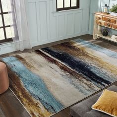 a living room area with a rug and chair