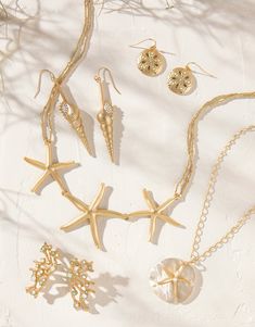 Calling all beachcombers! The fun of the hunt is right here in our Coastal Jewelry Collection, a wonderland of golden coral branches, crystal opals adorning the centers of sea stars and freshwater pearls nestled into crabs, moon shells and sand dollars. Elegant Starfish Charm Jewelry For Vacation, Elegant Starfish Shaped Jewelry For Vacation, Elegant Starfish Jewelry For Vacation, Ocean-inspired Jewelry With Lobster Clasp For Vacation, Ocean-inspired Gold Jewelry With Starfish Charm, Ocean-inspired Jewelry For Vacation With Lobster Clasp, Gold Shell Necklace With Starfish Charm On Strand, Starfish Jewelry For Vacation, Gold Coastal Jewelry Gift