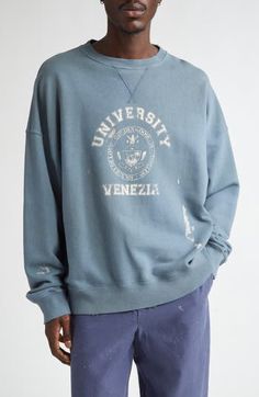 A fading collegiate logo fronts this 'dirty' cotton sweatshirt that features hand-worn areas on the edges and bleach spots for a signature distressed touch. Golden Goose's Journey Collection is an ode to Venice, drawing inspiration from the people who inhabit it and the different places discovered through the life of its lovers. 28" length (size X-Large) Crewneck Dropped shoulders Ribbed cuffs and hem 100% cotton Machine wash, line dry Made in Italy Designer Clothing Faded Distressed Sweatshirt For Streetwear, Sporty Washed Blue Cotton Sweatshirt, Blue Distressed Sweatshirt Relaxed Fit, Blue Distressed Relaxed Fit Sweatshirt, Distressed Blue Sweatshirt For Streetwear, Blue Distressed Crew Neck Sweatshirt, Blue Distressed Cotton Sweatshirt, Casual Distressed Crew Sweatshirt, Faded Distressed Crew Neck Sweatshirt