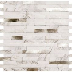 a white marble tile wall with silver foil strips