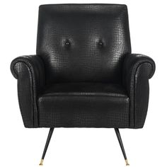 a black leather chair with gold legs and buttons on the armrests, against a white background