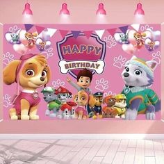 a room with a pink wall decorated with cartoon characters