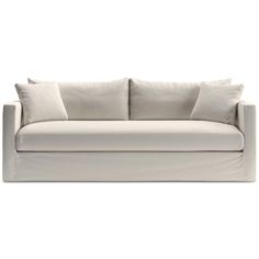 a white couch with two pillows on it's back and one arm folded up