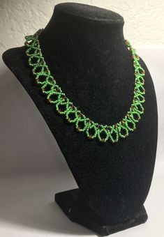 A handmade glass beaded necklace that is perfect for any occasion: parties, holidays, birthdays, anniversaries. All products are hand-crafted by my mother. Dimensions: - Actual Length: 21.0 cm - Collar Length: 13.0 cm - Width: 13.0 cm - Height: 2.0 cm Lightweight, high quality with a beaded hook as a clasp. Will respond to concerns and suggestions promptly. Shipping costs: Free Domestic Shipping. All orders are sent by air-mail with tracking number. Time of delivery: Estimated 1-3 days for domes Handmade Beaded Necklaces With Round Beads For Celebration, Handmade Beaded Bracelets With Round Beads For Celebration, Celebration Green Beaded Necklace With Colorful Beads, Beaded Jewelry With Oval Beads For Gift, Artisan Beaded Necklaces With Spacer Beads As Gift, Beaded Necklace With Oval Beads For Party, Green Handmade Beaded Necklaces For Celebrations, Handmade Green Glass Necklaces, Green Czech Glass Necklaces For Party