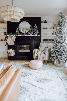 the living room is decorated for christmas with white decorations