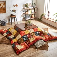 a living room filled with lots of furniture and decor on top of a wooden floor