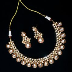 Exotic and snag-free kundan beaded necklace set with earrings. This is a stylish set with White Kundan. This set will work well with traditional, formal, and western formals. Eye-catching and unique jewelry that will set you apart. Gift this piece to a loved one, and see their face light up with joy. Best for gifting or for personal use, wear it to any occasion and become the spotlight. Option 1 : White (D536) Option 2 : Red & Green (D537) Western Formals, Necklace Set With Earrings, Silver Pooja Items, Glass Bangles, Silver Toe Rings, Gold Chain With Pendant, Kundan Necklace, Kundan Earrings, Kundan Necklaces