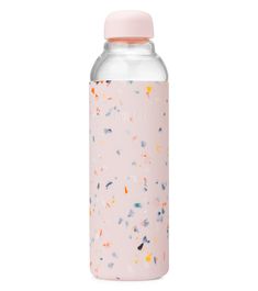 a pink water bottle with confetti sprinkles on it