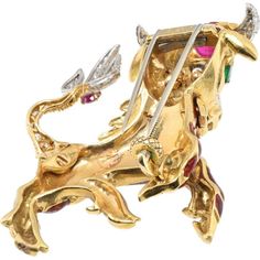 Explore the dimensions of design, where meticulous craftsmanship meets modern luxury in the exquisite David Webb Platinum & 18K Yellow Gold Red Enamel Bull Brooch. This timeless piece is a testament to elegance and sophistication, featuring cabochon and pear-cut rubies totaling approximately 3.0 carats that infuse a rich, vibrant allure into the brooch. Complementing this are pear-cut emeralds weighing around 0.25 carats, adding a delightful pop of color and a touch of refined elegance.The brilliance of this brooch is further enhanced by brilliant-cut and 8x8-cut diamonds, totaling approximately 1.20 carats, which create a mesmerizing sparkle, catching the light with every movement. Its dimensions, approximately 6.0 x 5.7 cm, make it a statement piece that commands attention and elevates a Luxury Cabochon Brooches For Anniversary, Luxury Anniversary Brooches With Cabochon, Luxury Gold Brooches With Cabochon, Luxury Yellow Gold Cabochon Brooches, Exquisite Collectible Jewelry Brooch, Exquisite Collectible Brooch Jewelry, Unique Gold Brooch With 17 Jewels, Unique Gold Brooches With 17 Jewels, Fine Jewelry Hallmarked Yellow Gold Brooches