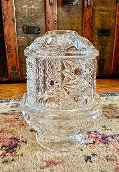 a glass box sitting on top of a rug