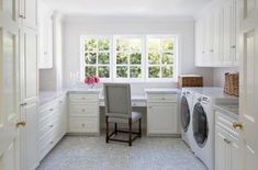 a washer and dryer in a white kitchen