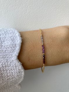 This  bracelet combines beautiful crystals that compliment each other and a dainty chain. D E T A I L S  *Made with a line up of AAA quality micro faceted gemstones. These are very small measuring  around 2mm. *These include iolite,  amethyst and garnet. *They are separated by seamless gold filled beads/sterling silver beads. *Choose between and 18k gold filled, rose gold filled and sterling silver chain. *Gold filled is a wonderful alternative to solid gold and unlike gold plating does not rub Elegant Purple Birthstone Beaded Bracelets, Elegant Sterling Silver Healing Crystal Bracelet, Purple Bracelet With Adjustable Chain As Gift, Elegant Purple Chain Bracelet As Gift, Dainty Purple Gemstone Bracelets, Amethyst And Garnet, Bar Bracelet, Garnet Bracelet, Bracelet Crystal