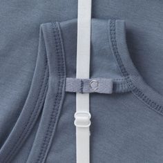 the back of a person's shirt with a white belt