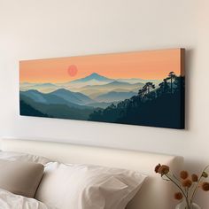 a painting hanging on the wall above a bed