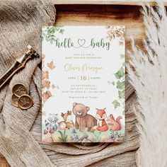 a baby shower with a bear, fox and other animals on it's cover