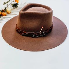 The Aspen Felt Fedora Hat is here to make a statement. This rancher-style hat is the perfect rustic piece to sport for your days in the great outdoors. Spice up any look with our unique braided leather matchstick band and wide smooth brim. #hats #fedorahats #felthats #ahm #americanhatmakers #wanderlustcollection Country Style Fedora Hat For Outdoor, Country Style Fedora For Outdoor, Western Style Hats For Outdoor Fall, Country Style Felt Hat For Outdoor Fall Use, Country Style Flat Brim Hat Bands For Outdoor, Outdoor Fall Hat With Curved Brim, Country Style Hat With Flat Crown For Outdoor, Outdoor Short Brim Hat For Fall, Rustic Adjustable Felt Hat With Short Brim