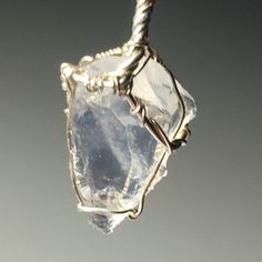 Aquamarine Sterling Silver Sire Wrap Pendant with solid silver chain.   Aquamarine has long been revered for its powers of positive influence and protection. It has a strong association with water, and the metaphorical qualities associated with water.  Going with the flow, clarity, peace and serenity, and cleansing among others.  It is said to alleviate sinus and lung problems, allergies and other respiratory conditions, and even said in folklore to help purify the air around you if kept on your Celestial Silver Crystal Necklaces For Healing, Spiritual Hand Wrapped Silver Necklace, Spiritual Hand-wrapped Silver Necklaces, Spiritual Silver Crystal Necklace Hand Wrapped, Ethereal Silver Crystal Necklace As A Gift, Ethereal Silver Crystal Necklace Gift, Mystical Silver Crystal Necklace For Meditation, Going With The Flow, Positive Influence